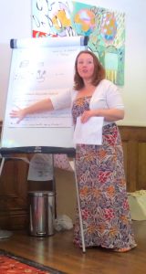 Woman standing in front of flip chart